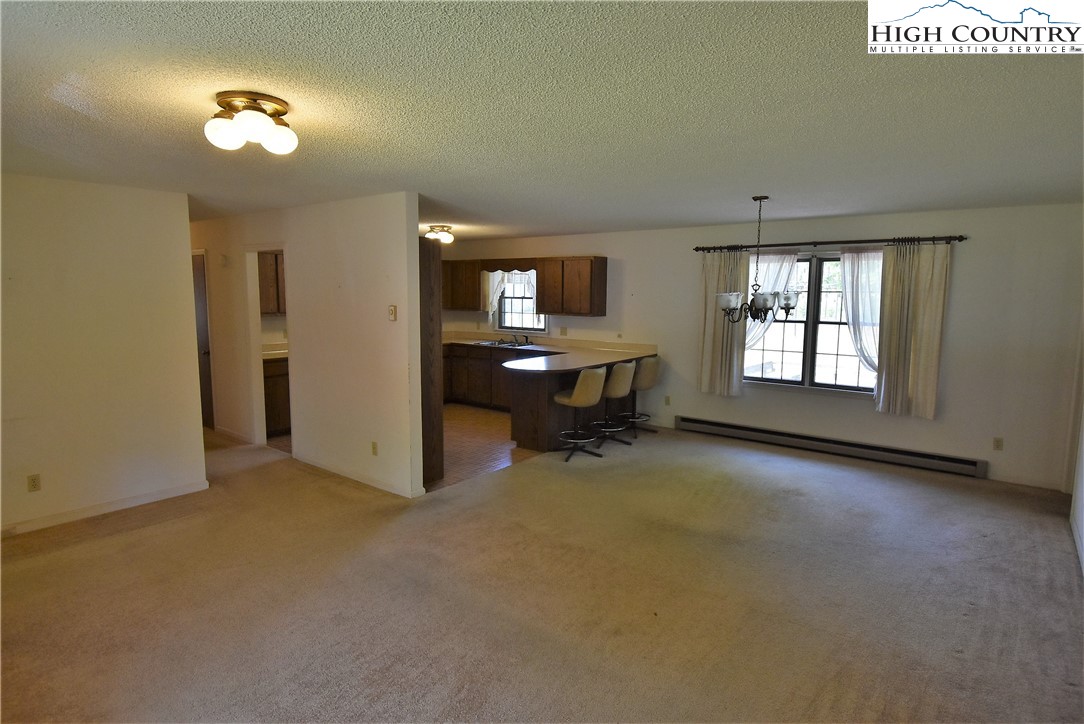 114 Dolinger Road Whitetop, VA 24292 - Photo 9 of 28 wooden floor in an empty room with a window