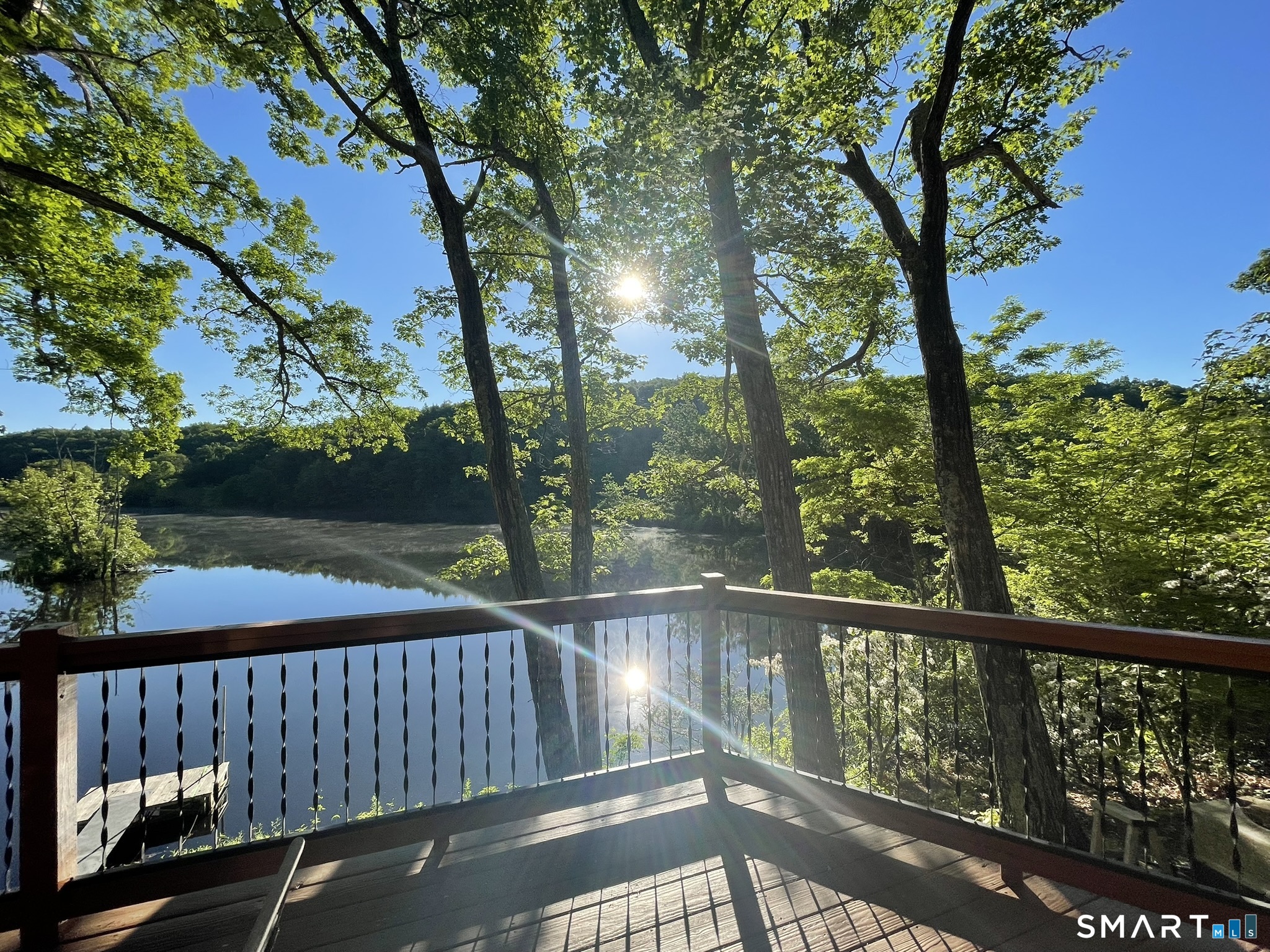 74 Cove Road, Unit 17 Haddam, CT 06424 - Photo 31 of 39 a view of a balcony with wooden floor and fence