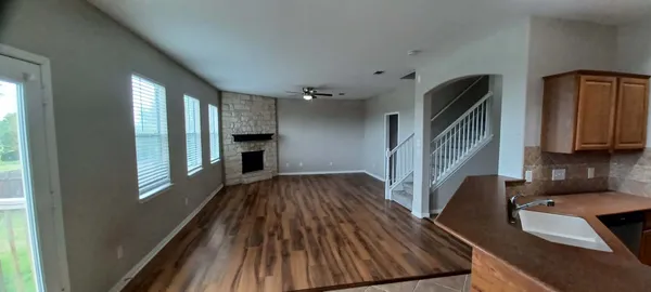 a view of a kitchen with furniture and a window