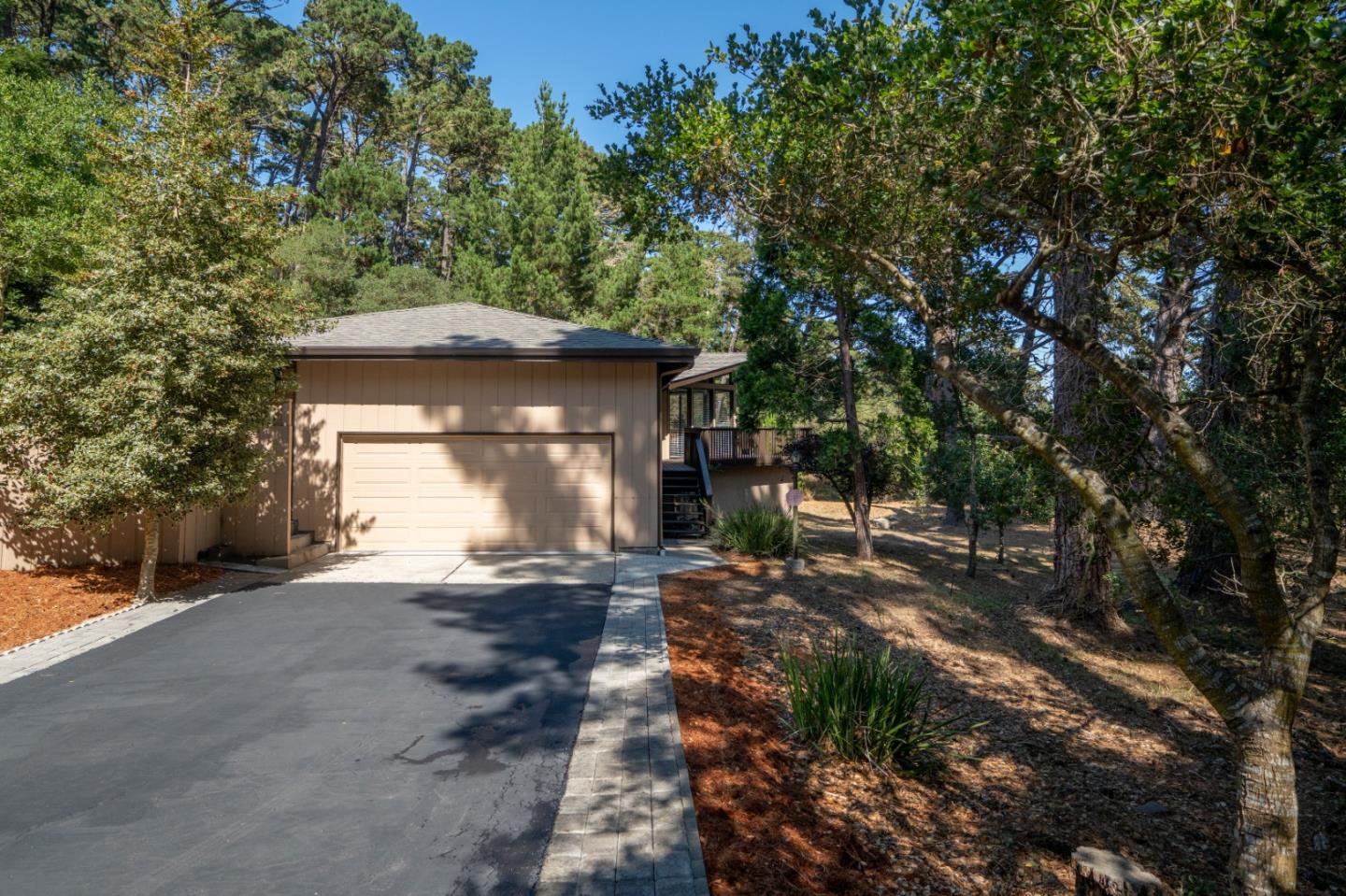 4059 Crest Road Pebble Beach, CA 93953 - Photo 2 of 27 a front view of a house with a yard
