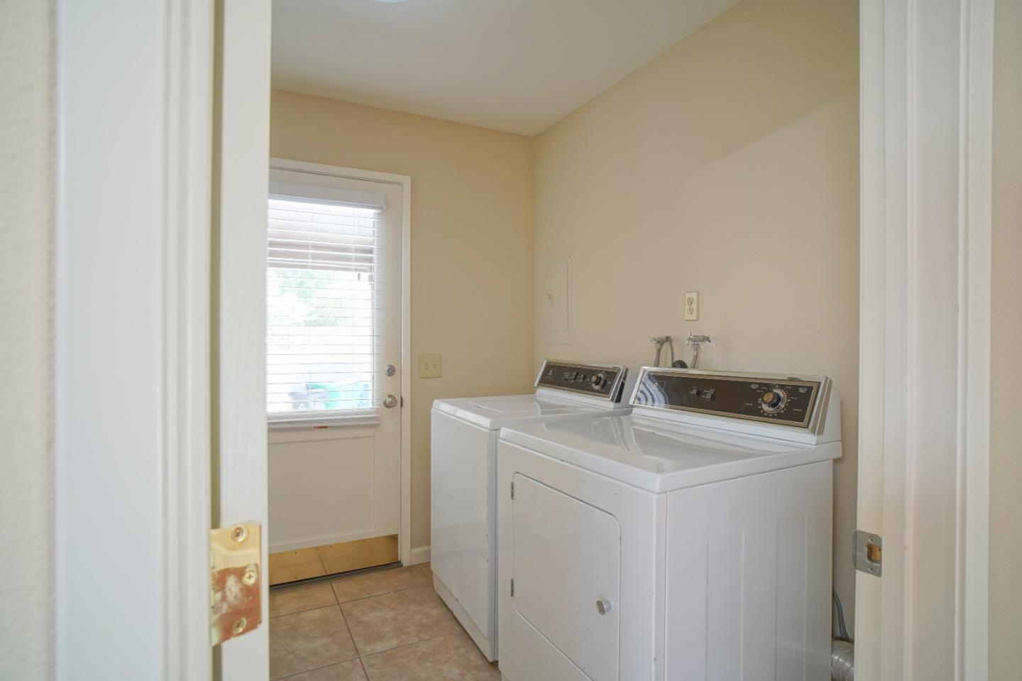 4059 Crest Road Pebble Beach, CA 93953 - Photo 21 of 27 a utility room with dryer and washer