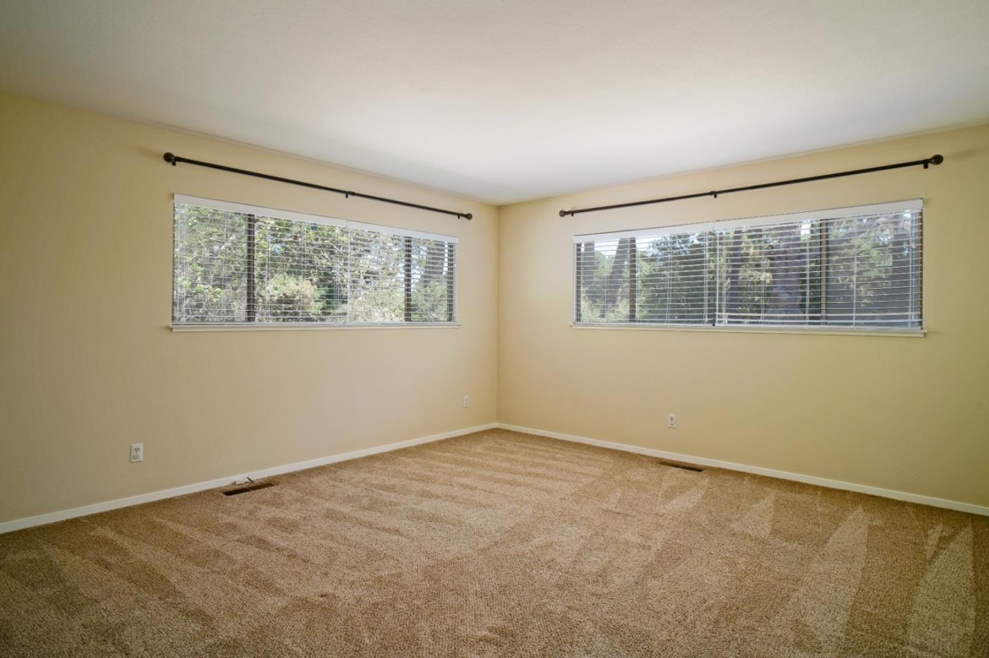 4059 Crest Road Pebble Beach, CA 93953 - Photo 22 of 27 an empty room with a window