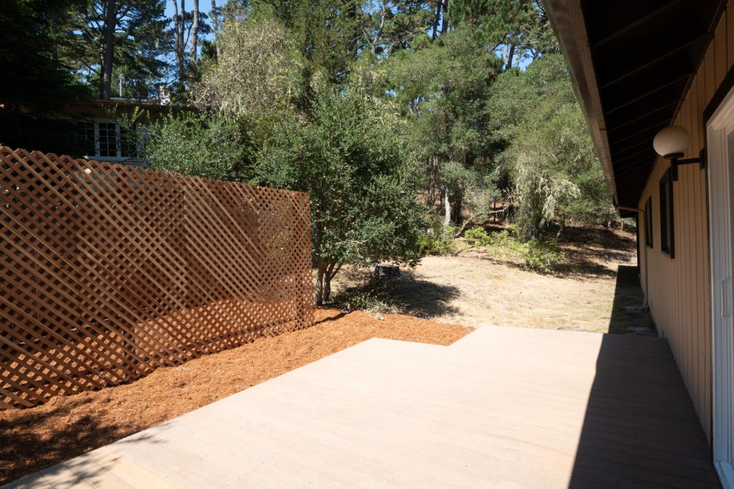 4059 Crest Road Pebble Beach, CA 93953 - Photo 4 of 27 a view of backyard with wooden fence