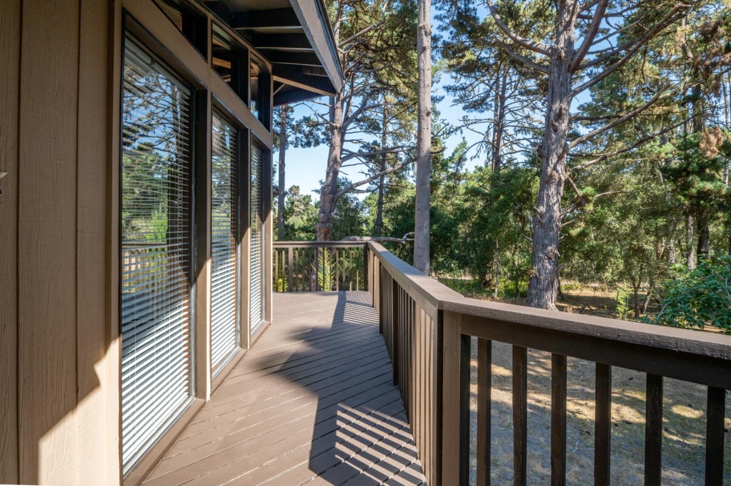 4059 Crest Road Pebble Beach, CA 93953 - Photo 6 of 27 a view of a balcony with wooden floor