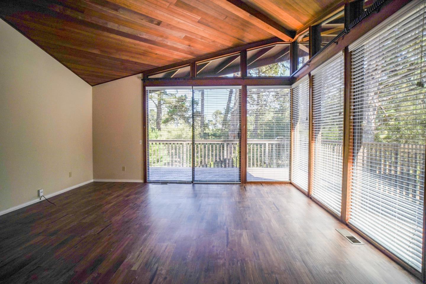 4059 Crest Road Pebble Beach, CA 93953 - Photo 7 of 27 a view of room with wooden floor and large window