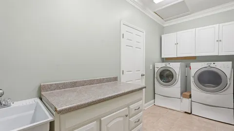 a spacious bathroom with a large tub and shower