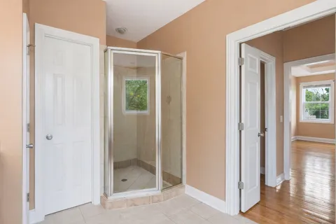 a bathroom with a sink vanity granite and toilet