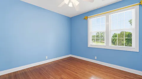 a bathroom with a sink mirror and toilet