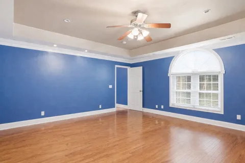 an empty room with a empty space and windows