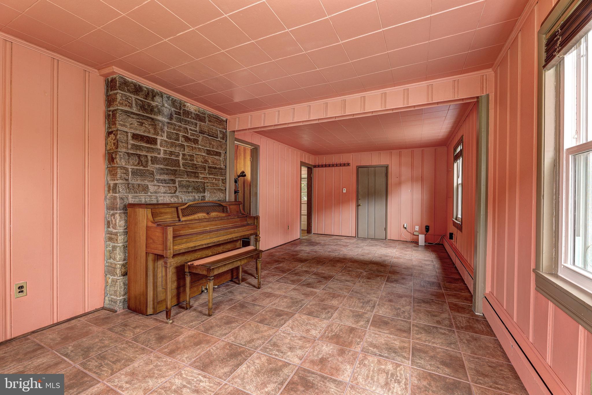 7500 Rocksham Drive Towson, MD 21286 - Photo 8 of 26 a view of an empty room with a birdcage and a window