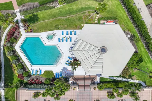 a view of a house with a backyard and sitting area