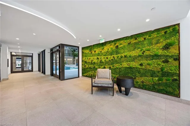 a balcony with furniture and garden view