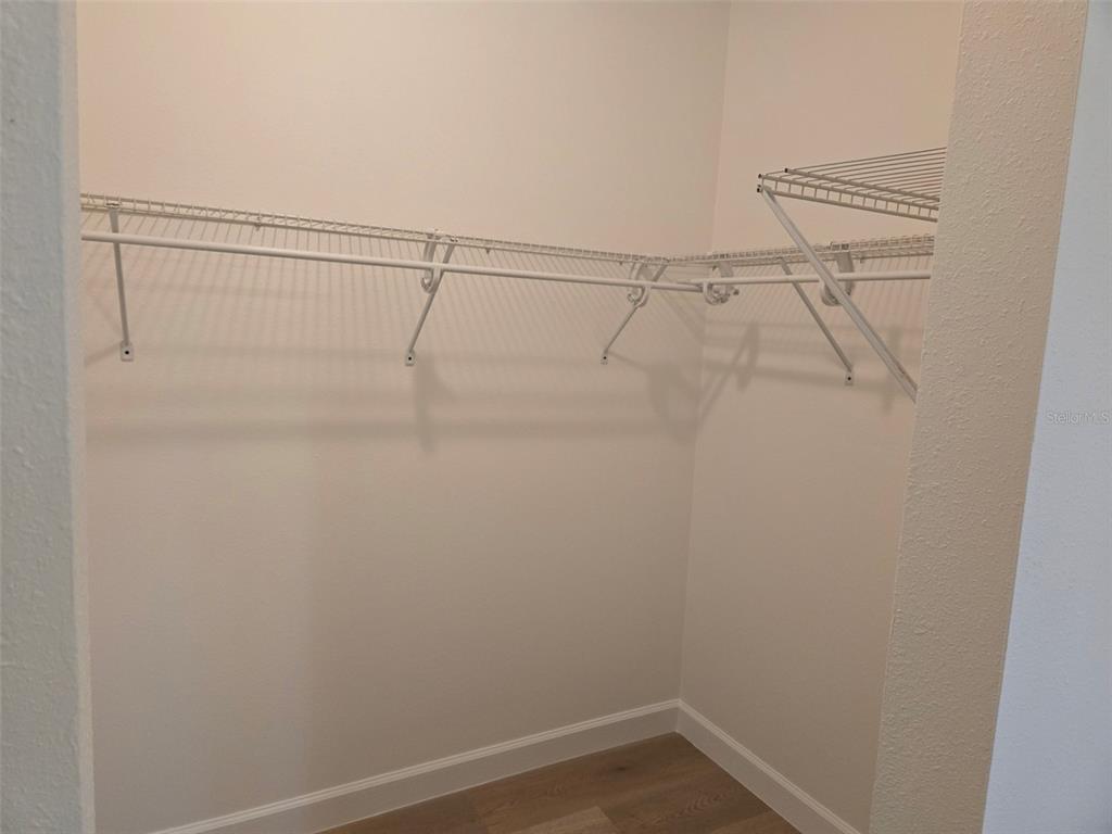 2115 5th Street, Unit 2 Sarasota, FL 34237 - Photo 12 of 22 a view of a room with racks on the wall