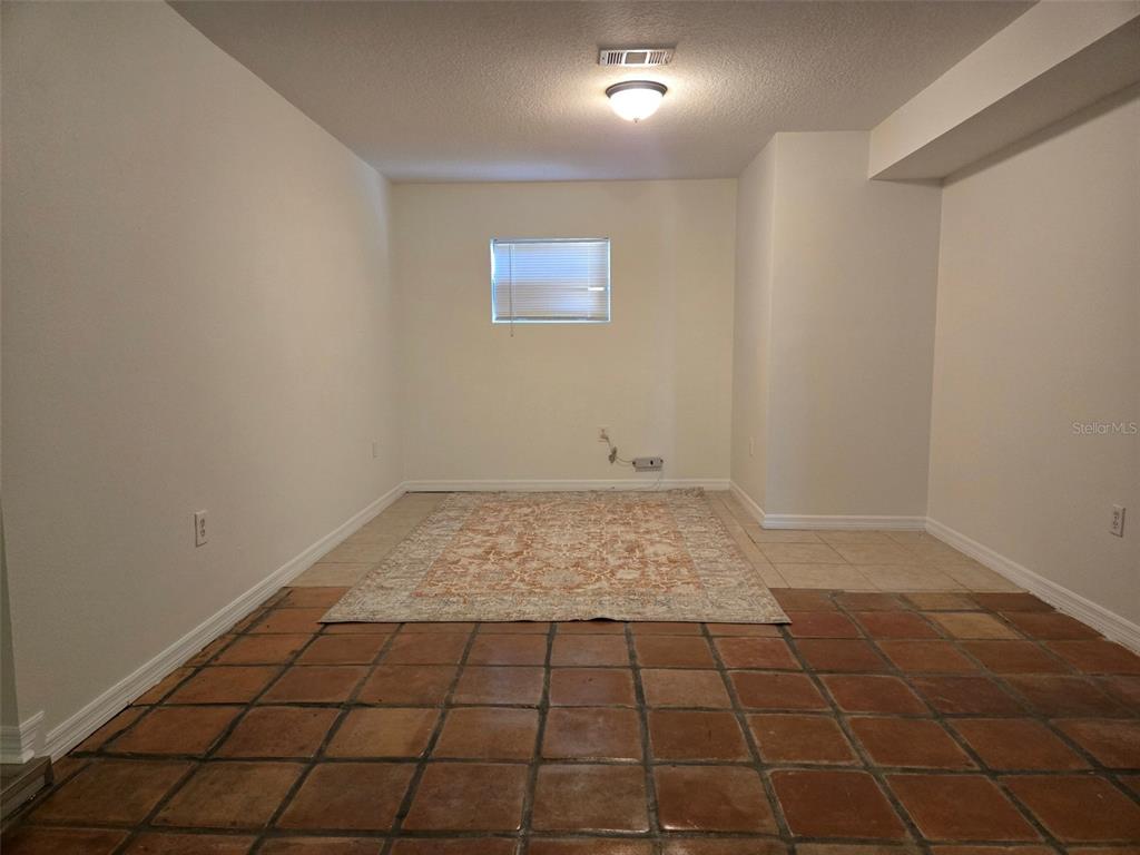2115 5th Street, Unit 2 Sarasota, FL 34237 - Photo 19 of 22 a view of an empty room and window