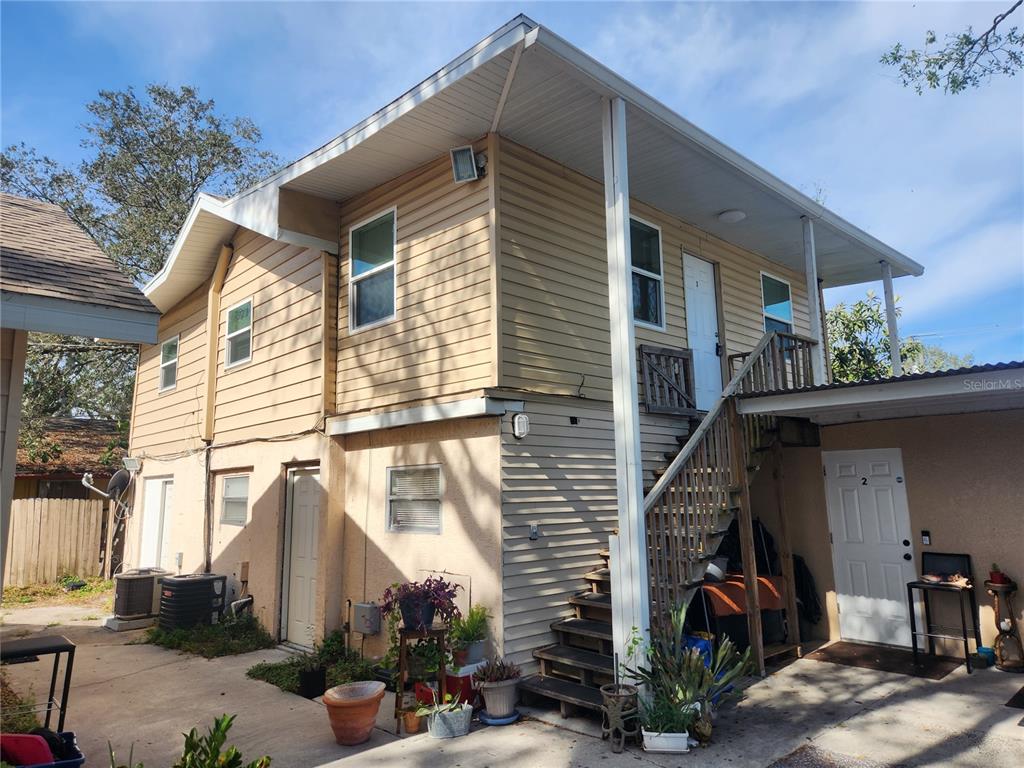 2115 5th Street, Unit 2 Sarasota, FL 34237 - Photo 2 of 22 a view of a house with a garage and balcony