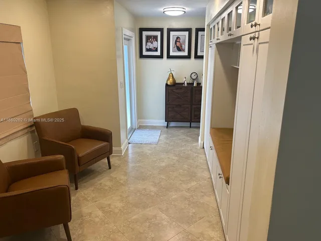 a bed room with a bed and a chair