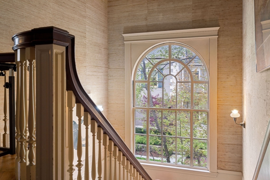 17 Berkeley Street Cambridge, MA 02138 - Photo 15 of 37 a view of an entryway door with a floor to ceiling window and a mirror