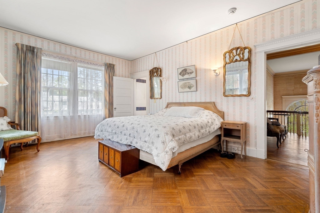 17 Berkeley Street Cambridge, MA 02138 - Photo 18 of 37 a bedroom with a bed and table