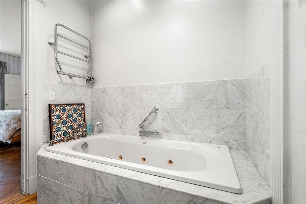 17 Berkeley Street Cambridge, MA 02138 - Photo 22 of 37 a bathroom with a bathtub