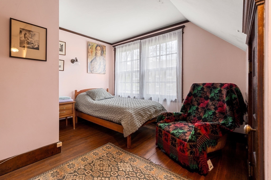 17 Berkeley Street Cambridge, MA 02138 - Photo 29 of 37 a bedroom with a bed and a window