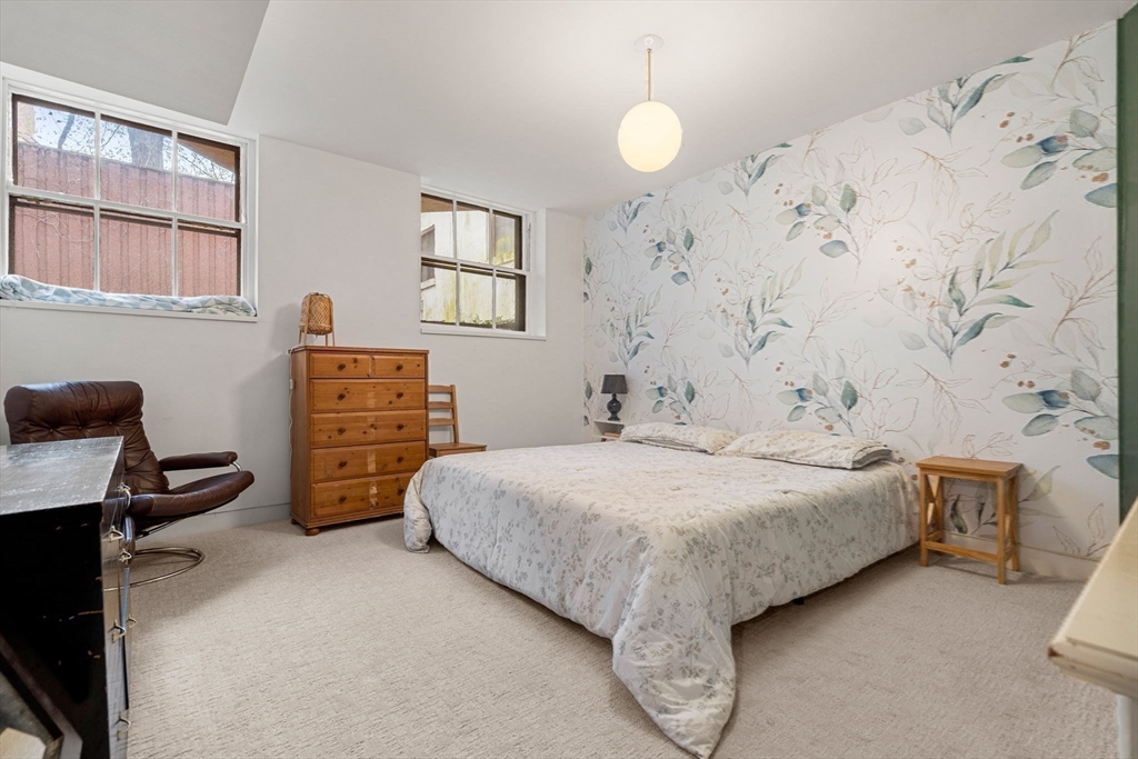 17 Berkeley Street Cambridge, MA 02138 - Photo 30 of 37 a bedroom with a bed and a desk