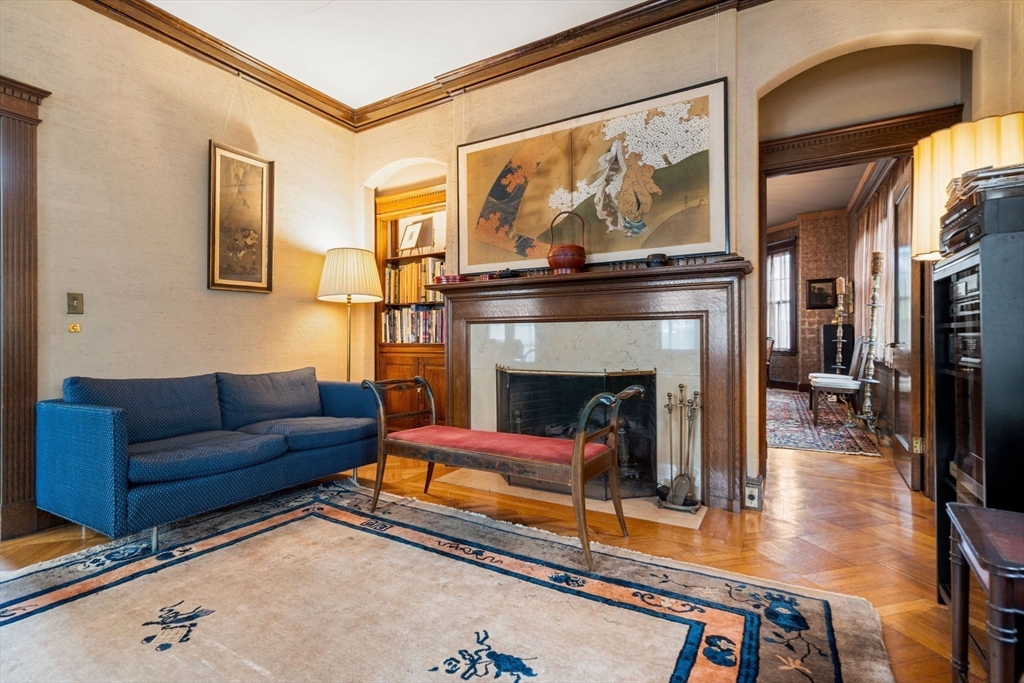 17 Berkeley Street Cambridge, MA 02138 - Photo 6 of 37 a living room with furniture a flat screen tv and a fireplace