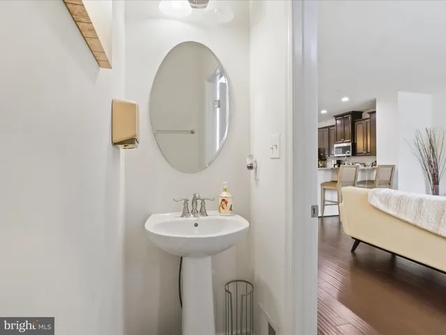 a view of a livingroom with workspace and a window