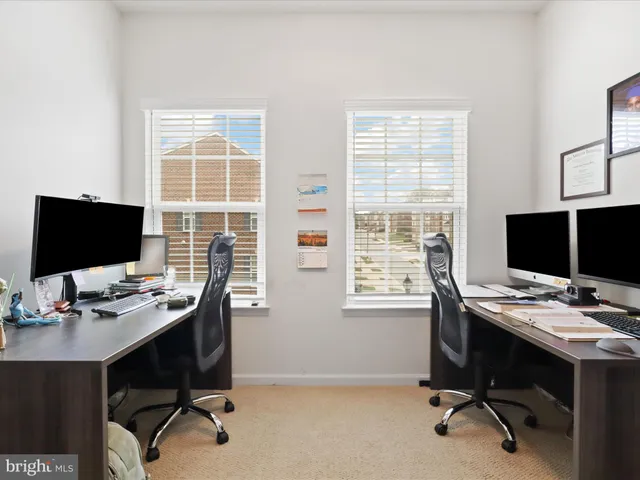 a bedroom with a large bed and a large window