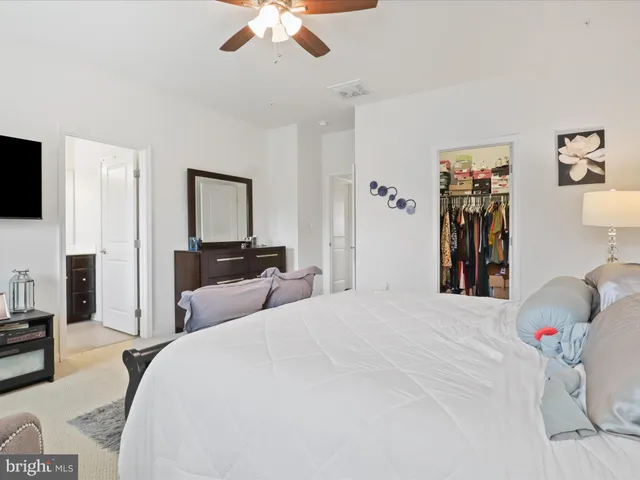 a living room with furniture a rug and a chandelier