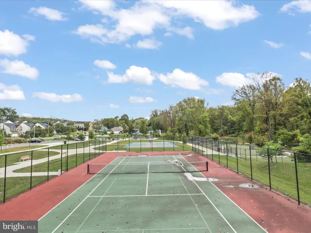 a view of a swimming pool with an outdoor space and seating area