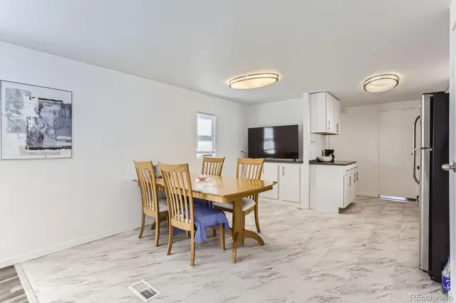 a view of a dining room with furniture