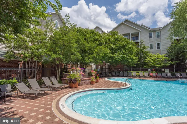 a view of a swimming pool with a patio