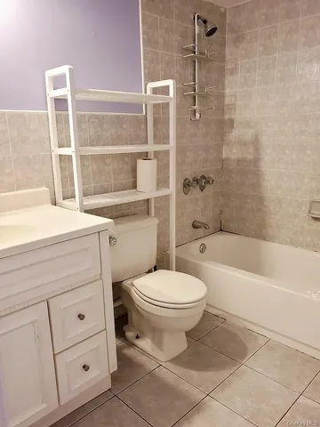 a bathroom with a sink a toilet and bathtub