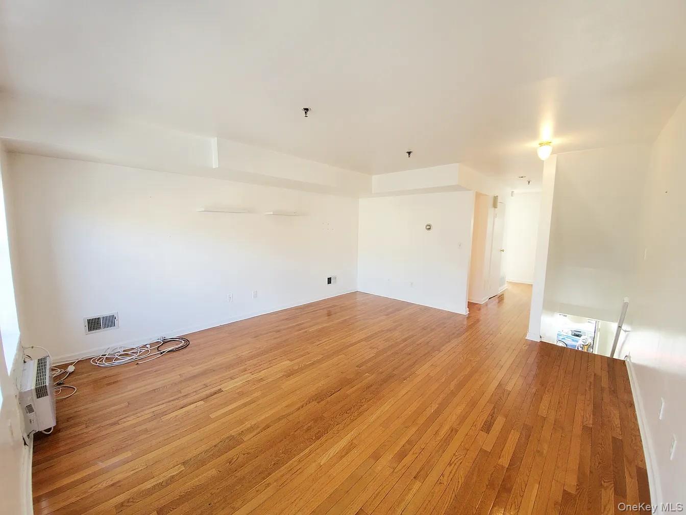 115 Vanderbilt Avenue, Unit 115A Brooklyn, NY 11205 - Photo 7 of 10 a view of empty room with wooden floor