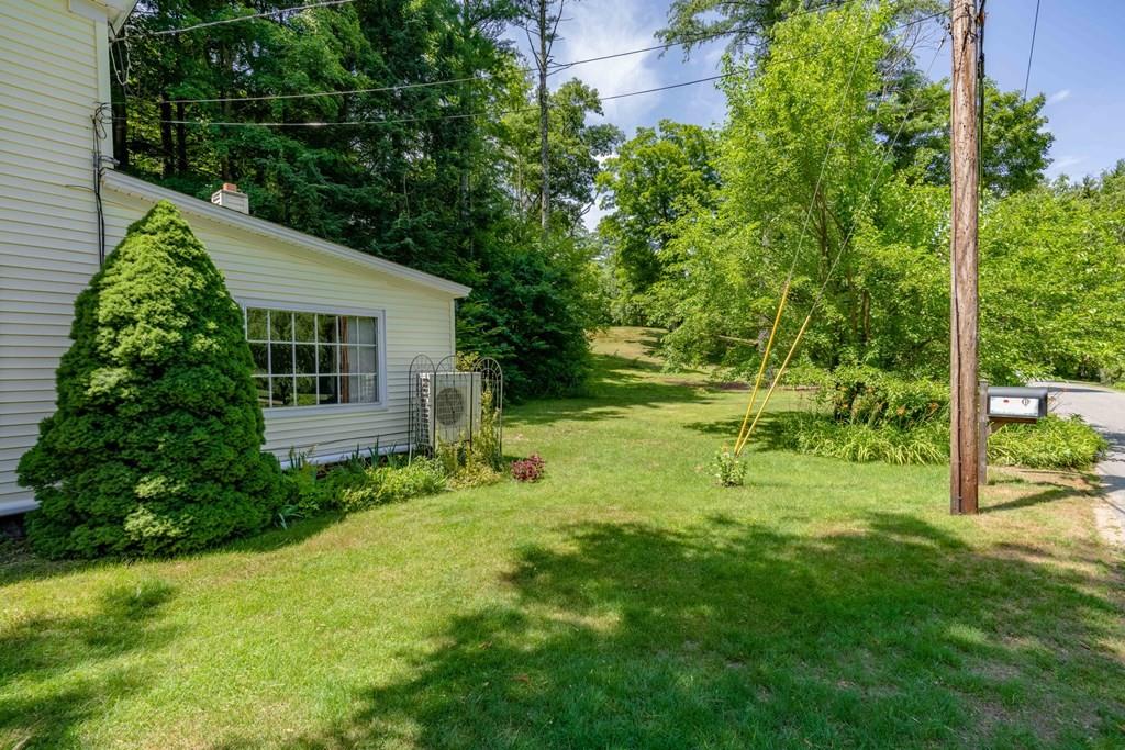 11 Dingley Dell Road Brimfield, MA 01010 - Photo 13 of 42 a view of backyard of house with a patio