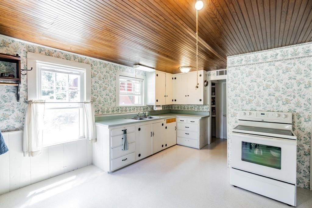 11 Dingley Dell Road Brimfield, MA 01010 - Photo 16 of 42 a large kitchen with granite countertop a stove a sink dishwasher and a refrigerator