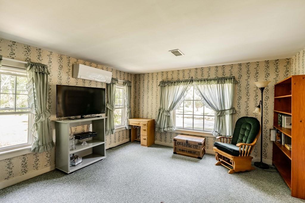 11 Dingley Dell Road Brimfield, MA 01010 - Photo 21 of 42 a room with furniture and a flat screen tv