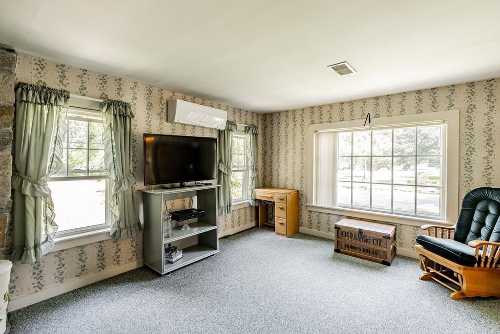 11 Dingley Dell Road Brimfield, MA 01010 - Photo 22 of 42 a living room with furniture and a flat screen tv