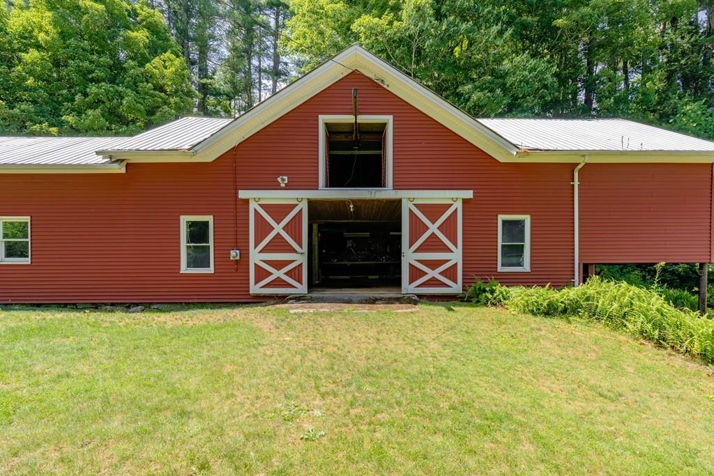 11 Dingley Dell Road Brimfield, MA 01010 - Photo 28 of 42 a backyard of a house with barbeque oven