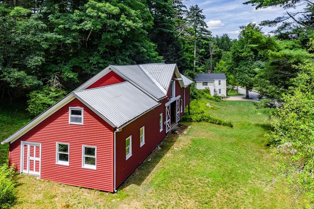 11 Dingley Dell Road Brimfield, MA 01010 - Photo 3 of 42 a aerial view of a house with yard and trees in the background