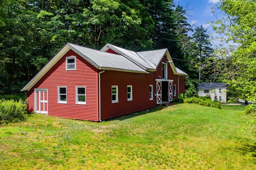 11 Dingley Dell Road Brimfield, MA 01010 - Photo 4 of 42 a front view of a house with garden