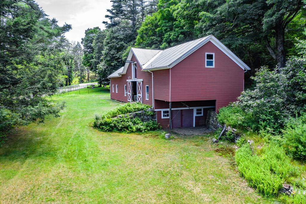 11 Dingley Dell Road Brimfield, MA 01010 - Photo 42 of 42 a view of a house with a yard and plants