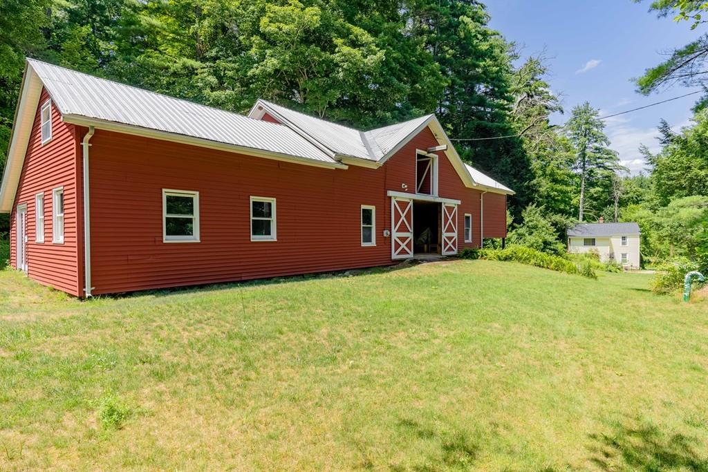 11 Dingley Dell Road Brimfield, MA 01010 - Photo 5 of 42 a house with huge green field in front of it