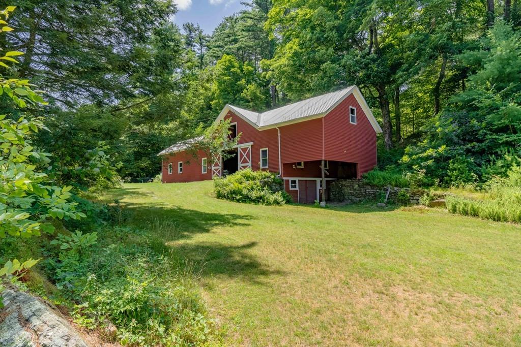 11 Dingley Dell Road Brimfield, MA 01010 - Photo 6 of 42 a aerial view of a house with a big yard plants and large trees