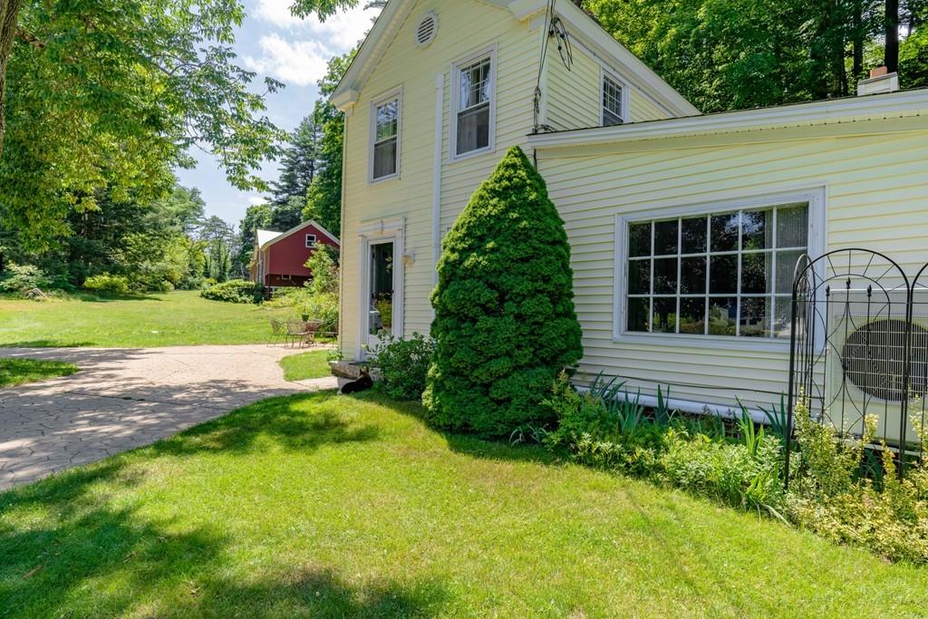 11 Dingley Dell Road Brimfield, MA 01010 - Photo 8 of 42 a view of a house with a yard and potted plants