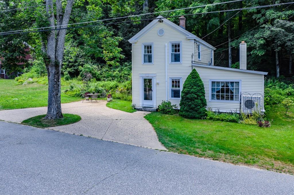 11 Dingley Dell Road Brimfield, MA 01010 - Photo 9 of 42 a view of a house with a small yard and large tree