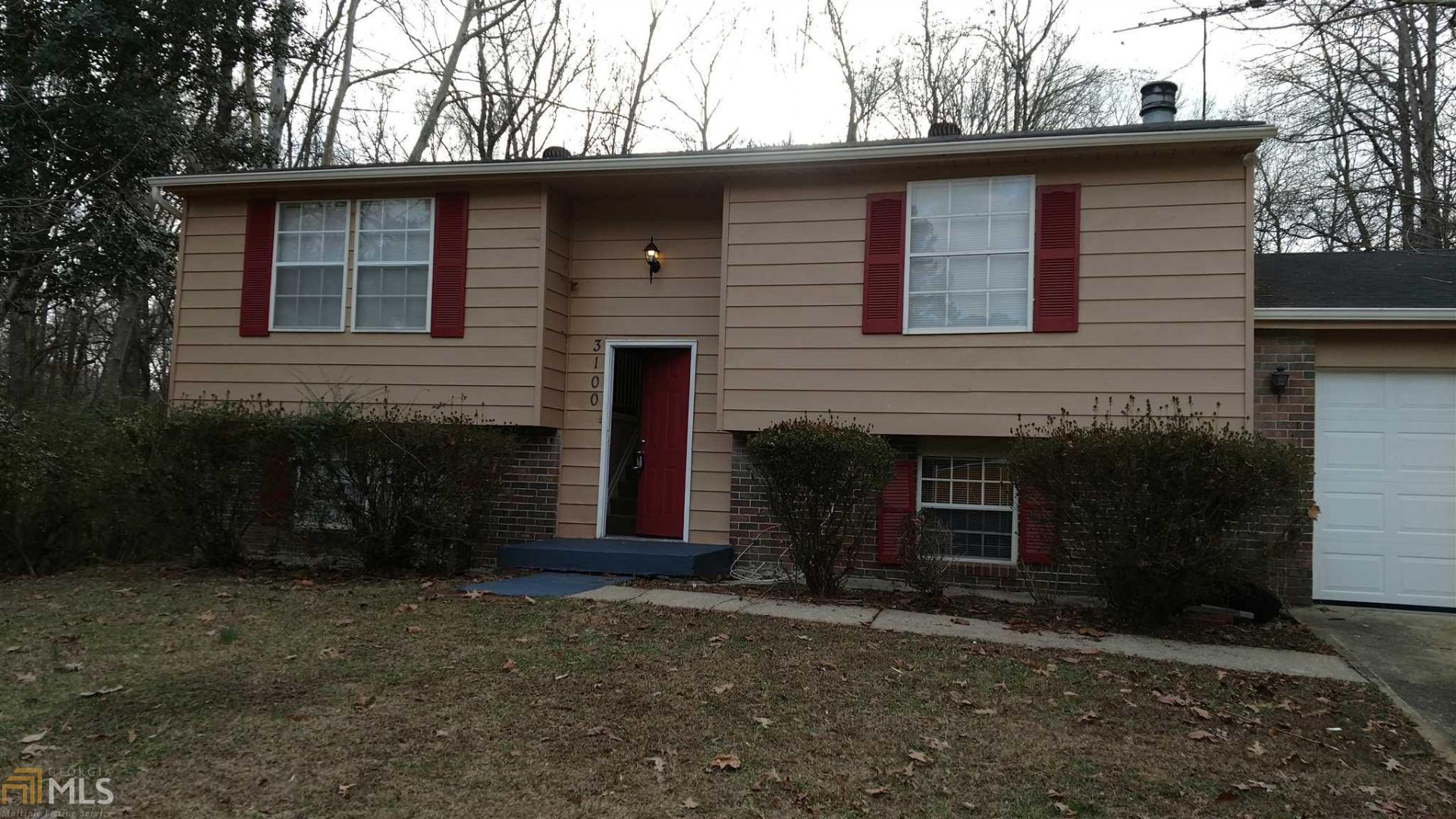 3100 Forestside Court Atlanta, GA 30349 - Photo 1 of 1 a front view of a house with a yard