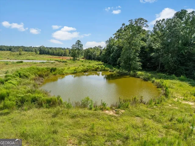 a view of a lake with a big yard