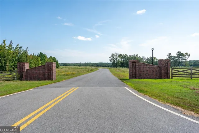 a view of a garden with a lake view