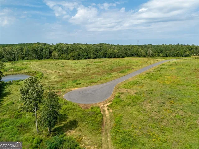 a view of a lake with a yard
